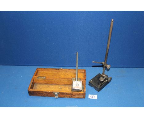 An engineer's dial gauge adjustable Pillar Stand by Moore & Wright, Sheffield, No 405 Hardened, 12 3/4" high and a wooden cas