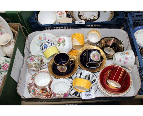 twelve coffee cans and saucers to include: Wedgwood, Crown Derby, Royal Albert, etc.
