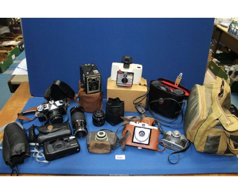 A quantity of cameras to include: "Polaroid" land Camera swinger model 20, a "Agfa" Isola 1, a "Pentax" zoom 60-X, a "Fujica"