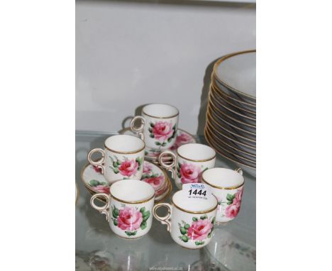 Six rose patterned coffee cupbs and saucers for 'T.Goode & Co, South Audley Street, Grosvenor Square', one cup with hairline 