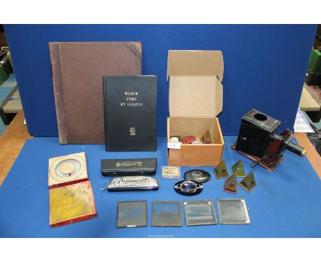 A tin plate toy Magic Lantern and slides, a vintage game, a "Hohner Chrometta harmonica, a Planiscope, a vintage large cabine