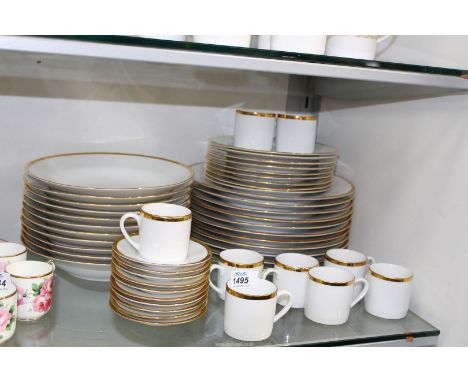 An Orialis porcelain part Dinner set to include; dinner plates, soup bowls, side plates, nine coffee cans and ten saucers.