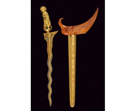 dating: 20th Century provenance: Bali, Undulated, double-edged blade, with central, gilded raiser decorated with effigies of 