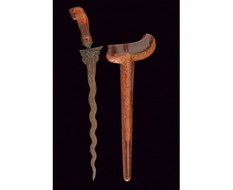 dating: circa 1900 provenance: Indonesia, Undulated, double-edged blade, in pamor, decorated at the base with portrays of two