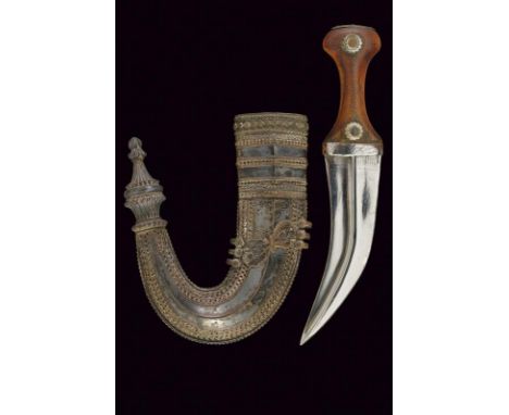 dating: circa 1900 provenance: Yemen, Curved, double-edged blade with central raiser. Horn grip with silver mounts and iron, 