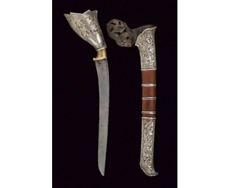 dating: 19th Century provenance: Sulawesi, Curved, single-edged blade, in pamor; grip covered with silver foil, embossed with