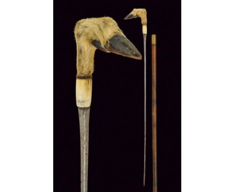 dating: Late 19th Century provenance: Europe, Cusp blade of square section. Bone grip and with animal's paw. Wooden, cylindri