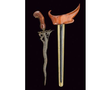dating: 19th Century provenance: Giava, Undulated, double-edged blade, made of pamor; pierced at the base, featuring a gilt '
