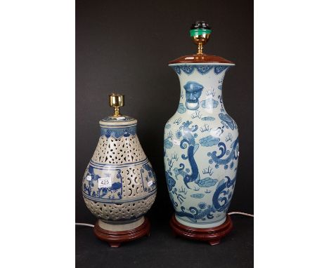 Two oriental style ceramic blue and white table lamps. 