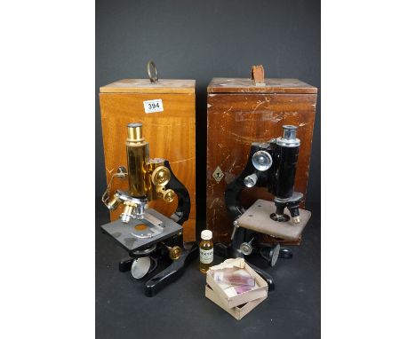 A vintage mid 20th century microscope by Watson &amp; sons together with a Leitz example, both boxed and complete with access