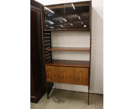 Staples Ladderax Rosewood Stacking Unit comprising a cabinet with two glazed sliding doors above a shelf above a bureau with 