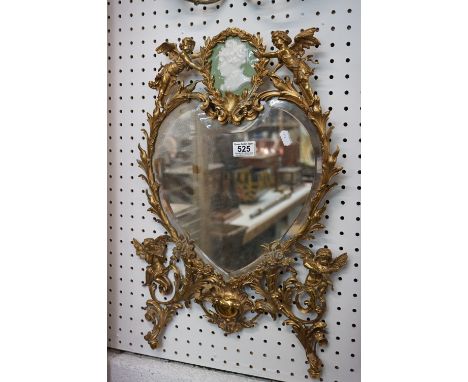 Heart Shaped Bevelled Plate Mirror contained within a Brass Foliate and Cherub Design Frame incorporating a Green and White C