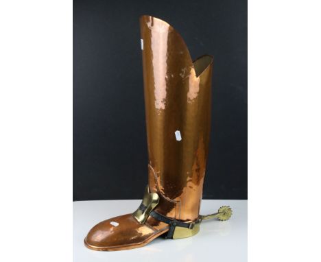 Copper and Brass Stick Stand in the form of a Postillon's Boot wearing a Brass and Leather Spur with Brass Buckle, 57cms high