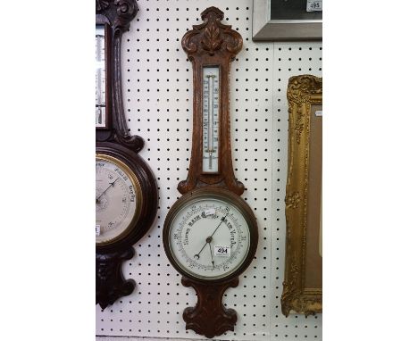 An oak cased wall hanging barometer with mercury thermometer. 