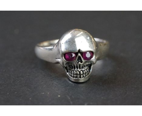 Silver skull ring with ruby style eyes 