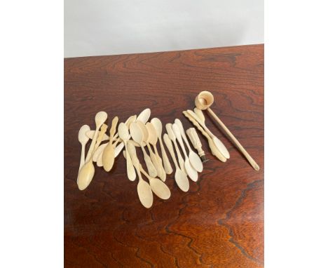 A Collection of antique bone spoons and, seal and ladle. 