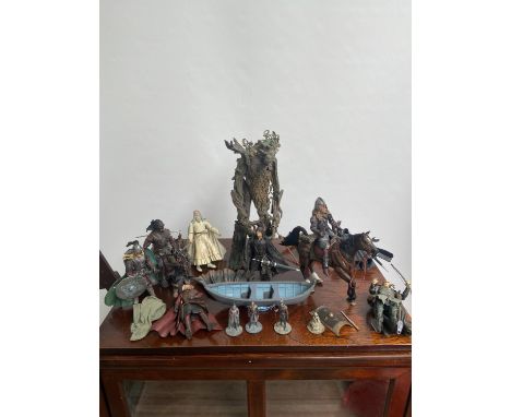 A collection of Lord of The Rings six inch figures, to include; small cast metal figures 