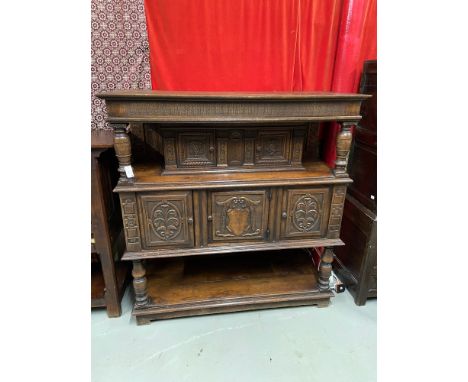 An Impressive 17th Century style oak court cupboard unit. Showing detailed carved panel doors and trims. A piece from Liberto