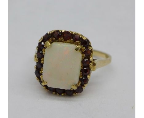 A 9ct gold, opal and garnet ring, 3.8g, P