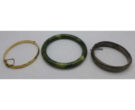 A silver bangle, a plated metal core bangle and a jade bangle