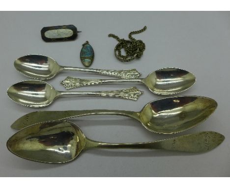 Five silver and white metal spoons, an enamel brooch, etc.