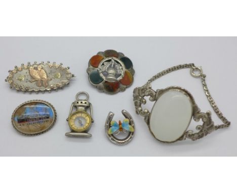 A sterling compass fob, a silver Scottish Cairngorm brooch, lacking pin, a sterling brooch, a silver and enamelled horseshoe 