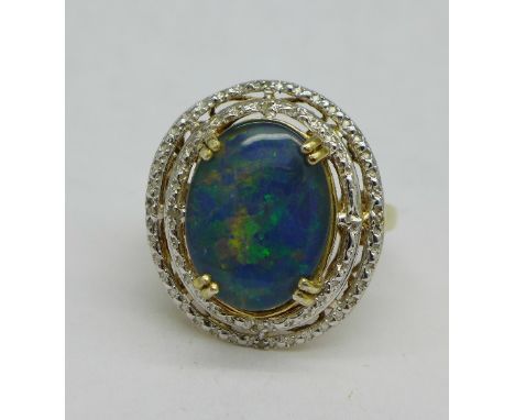 A silver gilt and doublet opal ring set with diamonds, S