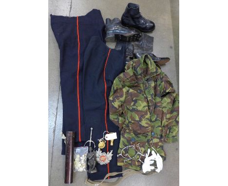 Two pairs of army boots, buttons, stirrups, fatigues and two pairs of trousers, badges, etc.