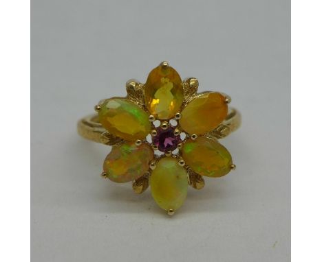 A 9ct gold, synthetic opal and tourmaline ring, 2.7g, O