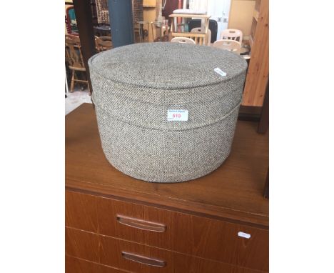 A ROUND POUFFE