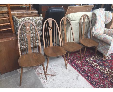 A SET OF 4 ERCOL SPINDLE BACK CHAIRS