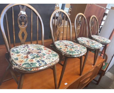 A SET OF 4 ERCOL CHAIRS