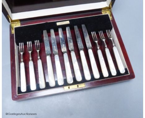   A George V cased set of six pairs of mother of pearl handled silver dessert eaters, Sheffield, 1933.
