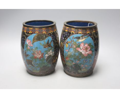   A pair of Japanese cloisonne enamel barrel-shaped vases and a similar bottle vase