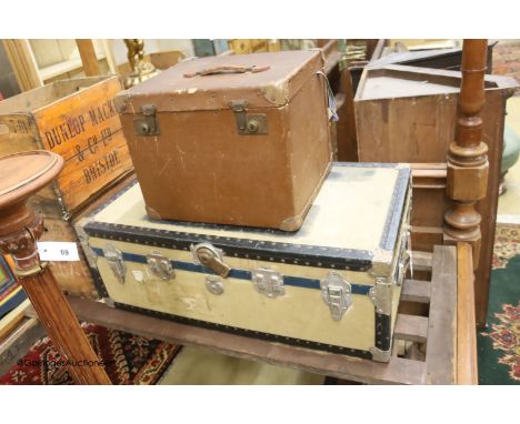   A Victorian tan leather and canvas domed top trunk, width 76cm, depth 60cm high together with two suitcases