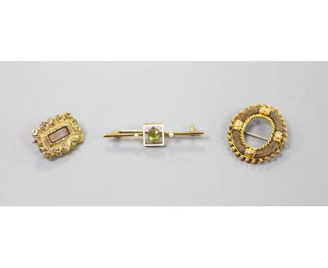   A George III gold plated mourning brooch, 20mm, a 19th century yellow metal and plaited hair openwork brooch, and an early 