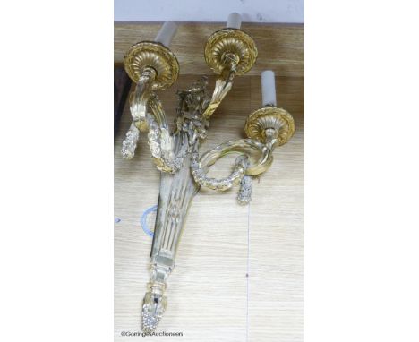   A gilt cast metal three branch wall light, 55cm high.
