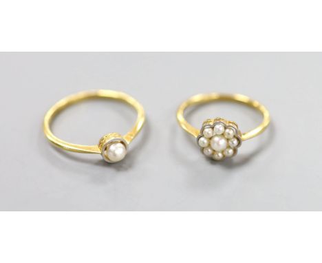   Two 18ct and cultured pearl set rings (single stone and cluster), sizes S &amp; O, gross weight 5 grams.