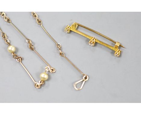   An early 20th century yellow metal and three stone diamond set bar brooch, 36mm, gross 1.6 grams and a yellow metal and sim