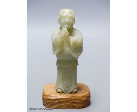   A Chinese celadon jade figure of a priest