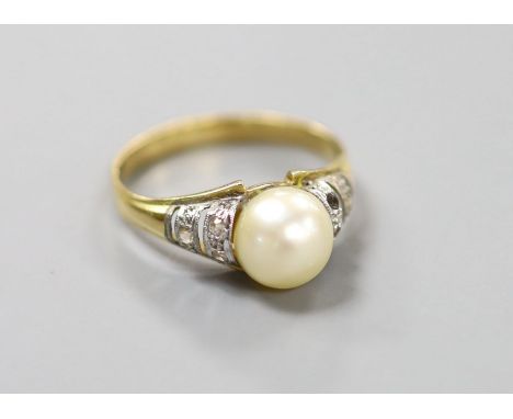   A modern yellow metal, cultured pearl and gem set ring, size O, gross weight 3.3 grams,pearl diameter 7.7mm.
