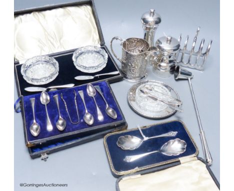   Two silver capstan pepper mills, a cased pair of silver preserve spoons, a Mappin &amp; Webb silver and cut glass butter di