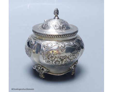   An Edwardian embossed silver bombe shaped tea caddy, Williams (Birmingham) Ltd, Birmingham, 1903, height 11cm, 5.5oz.