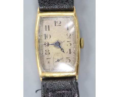   A gentleman's 1930's 9ct gold manual wind tonneau shaped wrist watch, with case back inscription, on leather strap,case dia