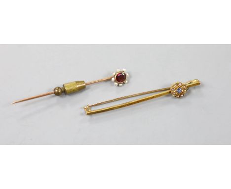   An Edwardian 15ct and gem set flower head bar brooch, 59mm, gross 3.7 grams and a yellow metal , garnet and seed pearl set 