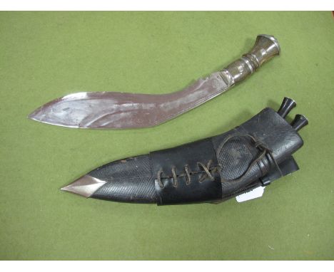 A Mid XX Century Horn Handled Kukri, with two skinning knives, leather scabbard and leather frog.