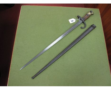 A French Gras Bayonet and Steel Scabbard Dated 1877, spring appears to work, pitting to scabbard.