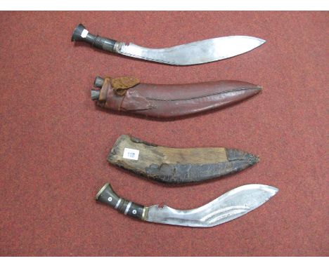 Two Mid XX Century Kukri, one with skinning knives in leather covered scabbard, one in poor scabbard.