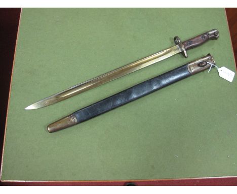 A 1907 Pattern WWI Period Lee Enfield Bayonet, with leather scabbard, spring seized.