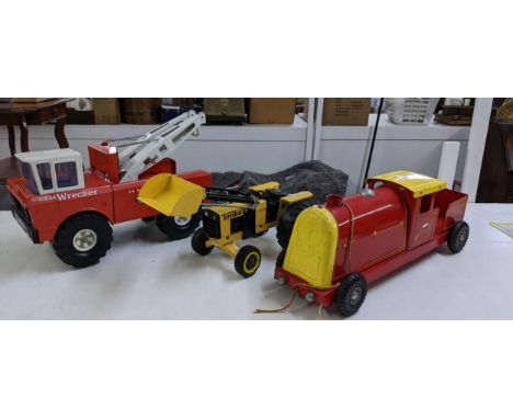 Three tin plate unboxed Diecast toys to include a Tonka front loading tractor, a Mighty Tonka Wrecker, and a Triang Express p